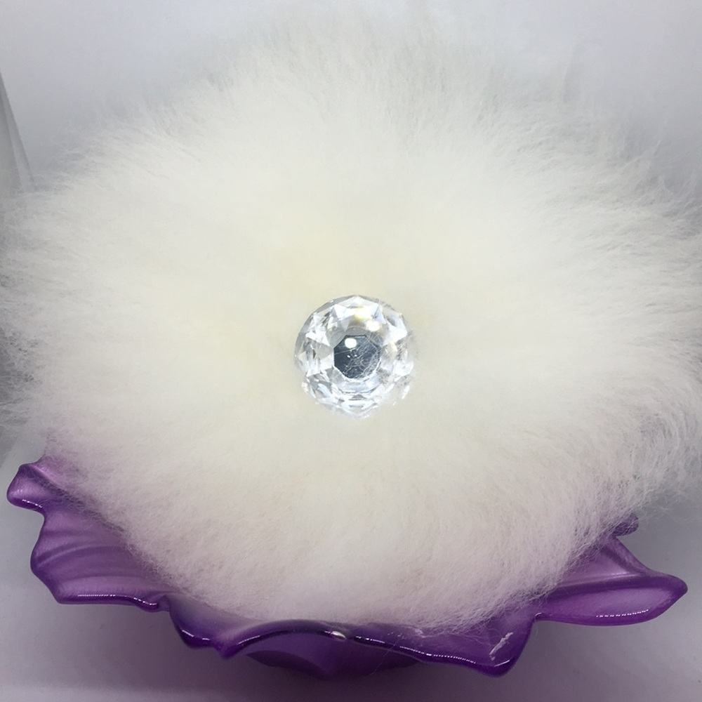 Merino powderpuff and talc free powder.